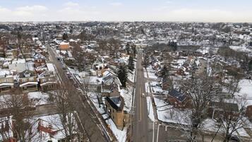 A residential area with snow-covered houses and streets.
