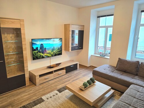 Ground floor apartment + balcony + private parking space