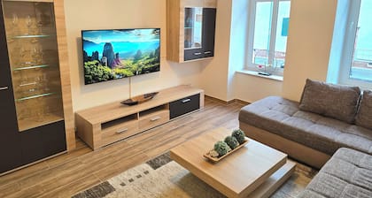 Ground floor apartment + balcony + private parking space