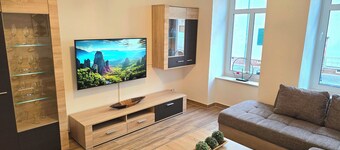 Ground floor apartment + balcony + private parking space