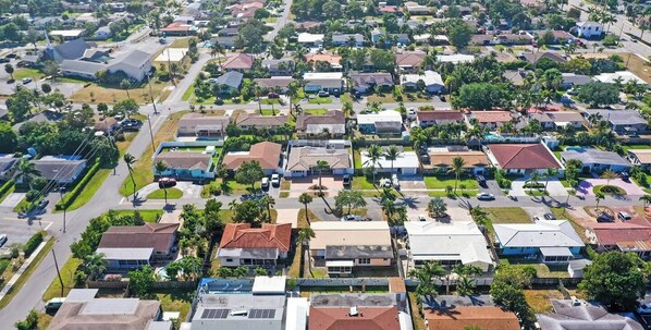 A residential area with houses, streets, and greenery.