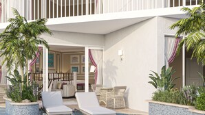 A poolside area with lounge chairs, a dining set, and potted plants. - The Grand Resort, Rarotonga (Rarotonga)