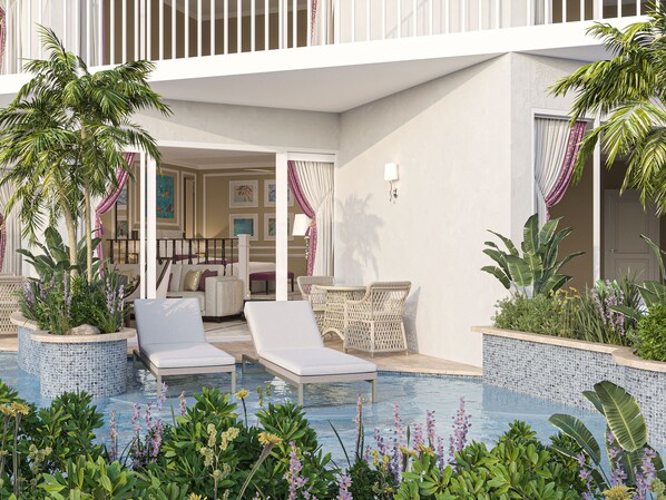 Un espace aménagé au bord de la piscine, avec des chaises longues, un ensemble de mobilier de jardin et des plantes en pot.