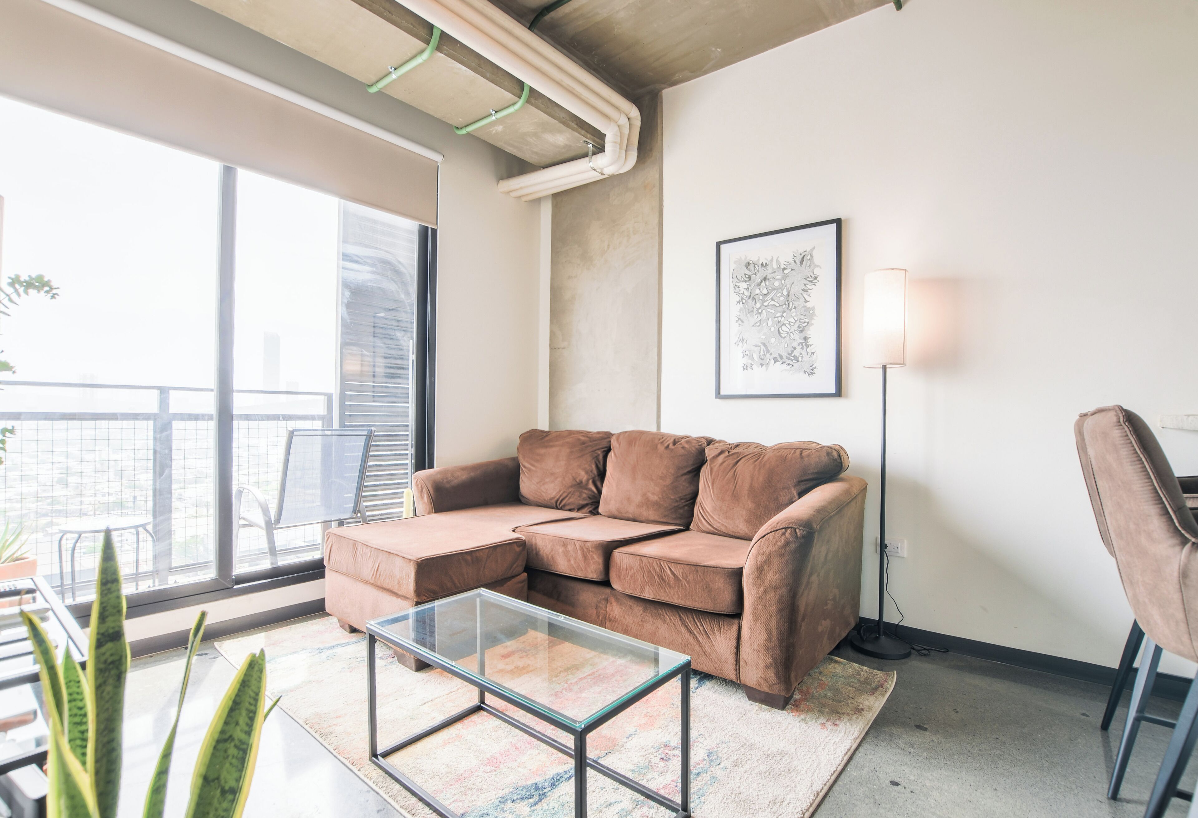 Suite junior, balcón, vistas a la ciudad | Zona de estar