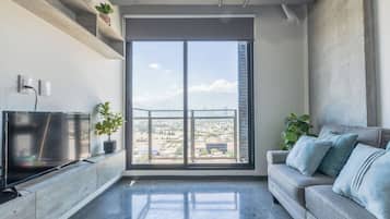 Comfort Suite, Balcony, City View | Living area | 55-inch Smart TV with digital channels, streaming services