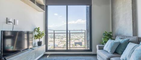Comfort Suite, Balcony, City View | Living area | 55-inch Smart TV with digital channels, streaming services