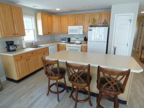 Fridge, microwave, oven, stovetop - Comfortable Southend 4BR Condo • Sleeps 8 • Deck, Parking & Outdoor Shower (Ocean City)
