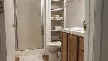 Shower, hair dryer, towels, soap