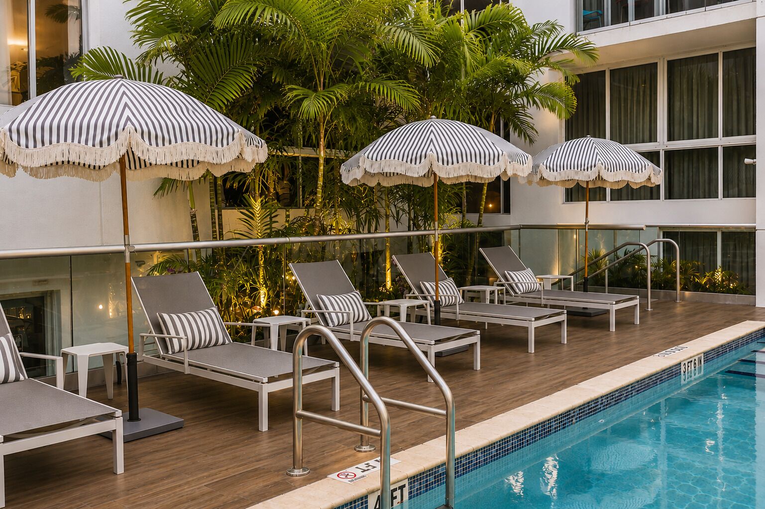Outdoor pool, open 7:00 AM to 9:00 PM, pool umbrellas, pool loungers