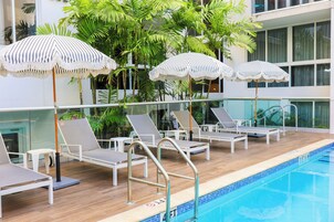 Outdoor pool, open 7:00 AM to 9:00 PM, pool umbrellas, sun loungers