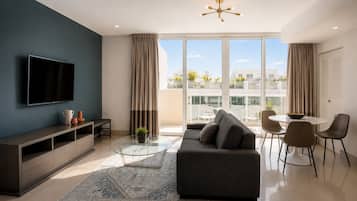 Standard Apartment, 1 King Bed with Sofa bed | Living area | 55-inch Smart TV with satellite channels