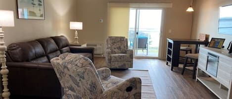 Deluxe Suite, River View | Living area | 43-inch LED TV with digital channels