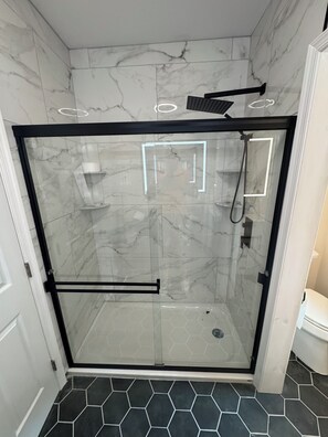 Shower, towels, soap, toilet paper