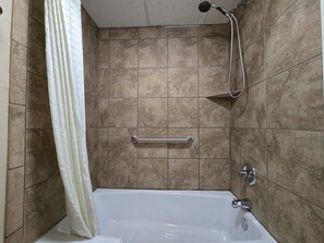 Combined shower/bathtub, hair dryer, towels, soap