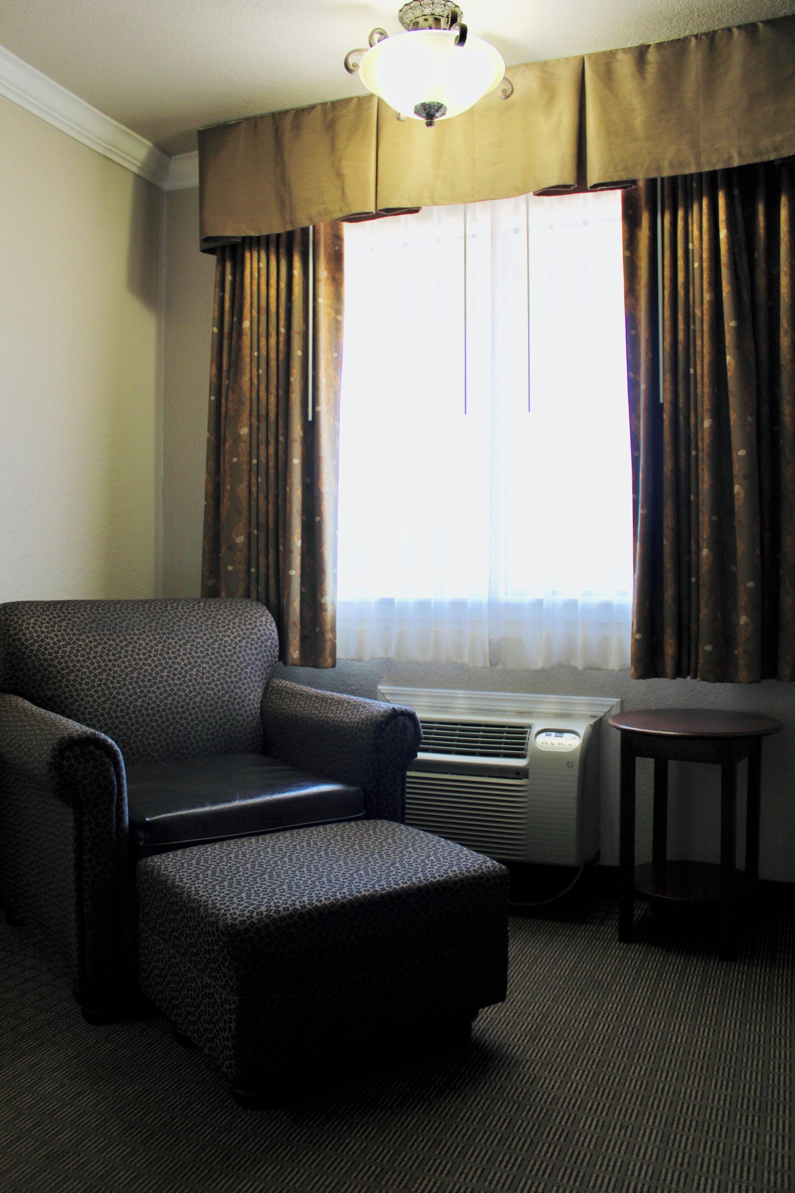 Desk, laptop workspace, blackout drapes, iron/ironing board