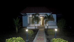 A small, single-story building with a tiled entrance and a pathway leading to the door. - Sonchafa Resort Pauni (Pawni)