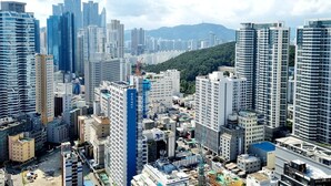 A high-rise urban area with modern buildings and a dense skyline.