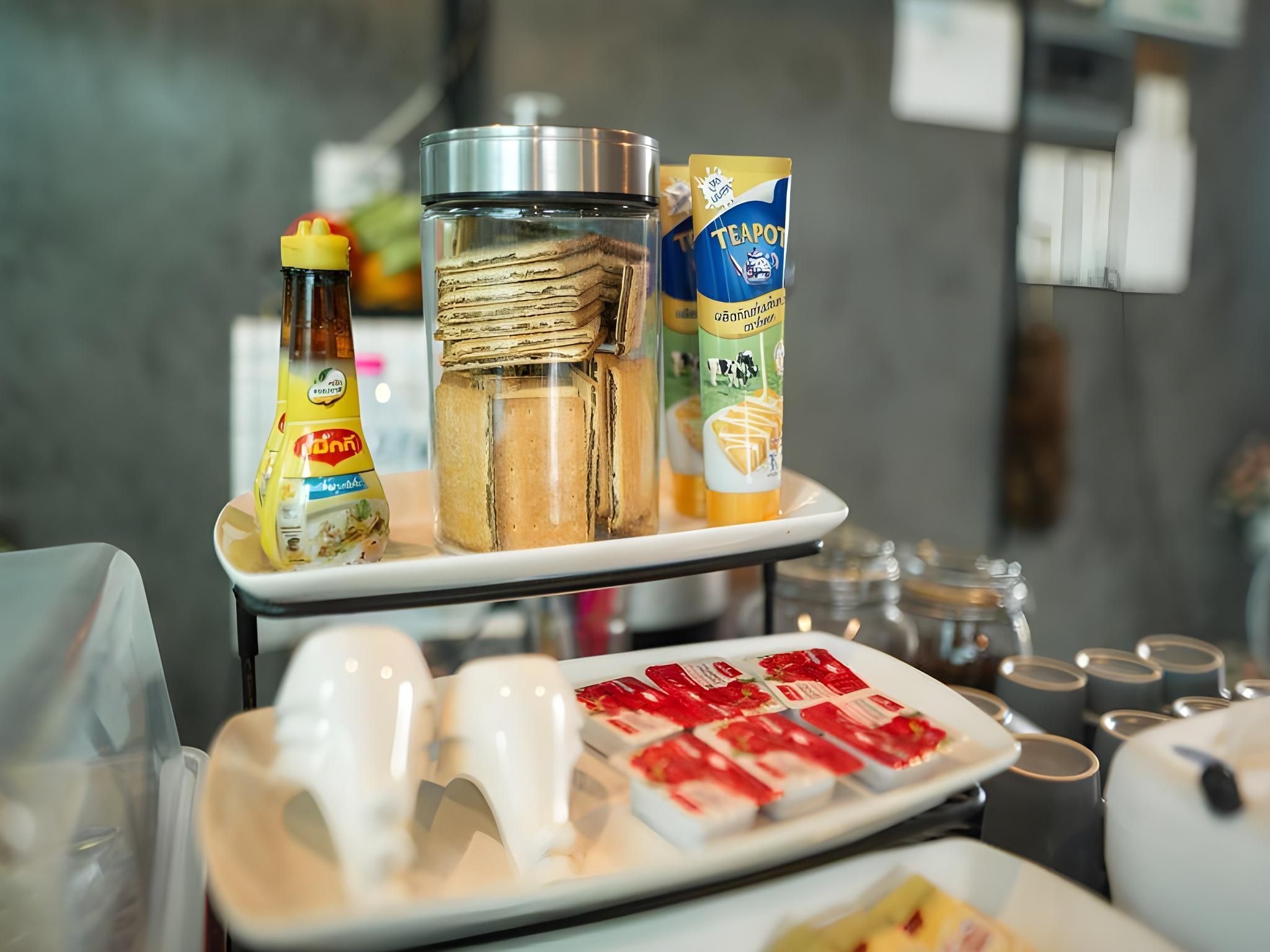 A breakfast buffet with various food items and condiments.