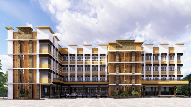A multi-story hotel with a modern architectural design, featuring balconies and a central courtyard. - Luxebridge Hotel (Davao)