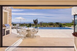 Outdoor dining - 4BR Ocean & Golf Views | Golf Cart + Transport Inc (Cabo San Lucas)