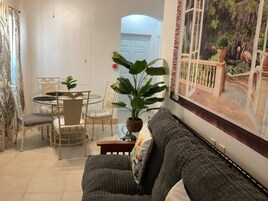 Comfort Condo, Balcony, Garden View | Living area | 43-inch LED TV with digital channels, Netflix, Hulu