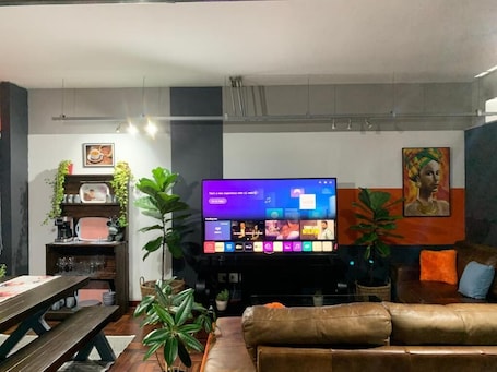 Interior. Ambient studio with huge TV and Pool