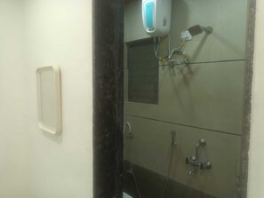 Family Room | Bathroom | Shower, free toiletries, towels, soap - Hotel Kulswamini Inn (Nashik)