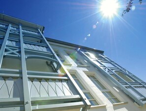 A building with a modern architectural design, featuring a prominent staircase and large windows. - Ferienwohnungen im Seepark Sellin (Sellin)