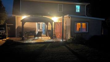 A house with a covered garage and a small porch area.