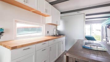 Microwave, stovetop, coffee/tea maker, cookware/dishes/utensils