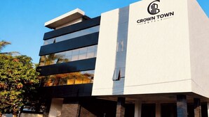 A modern hotel building with a prominent logo and name 'Crown Town Hotels'. - Crown Town Hotel Kalamassery (Aluva)