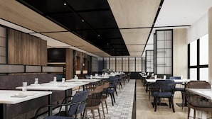 A modern dining area with long tables, chairs, and a patterned floor. - Four Points by Sheraton Kunming Chenggong (Kunming)