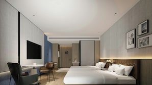 A modern hotel room with a large bed, a desk, a chair, and a TV. - Four Points by Sheraton Kunming Chenggong (Kunming)