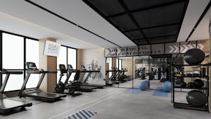 A modern gym with treadmills, exercise balls, and weightlifting equipment. - Four Points by Sheraton Kunming Chenggong (Kunming)