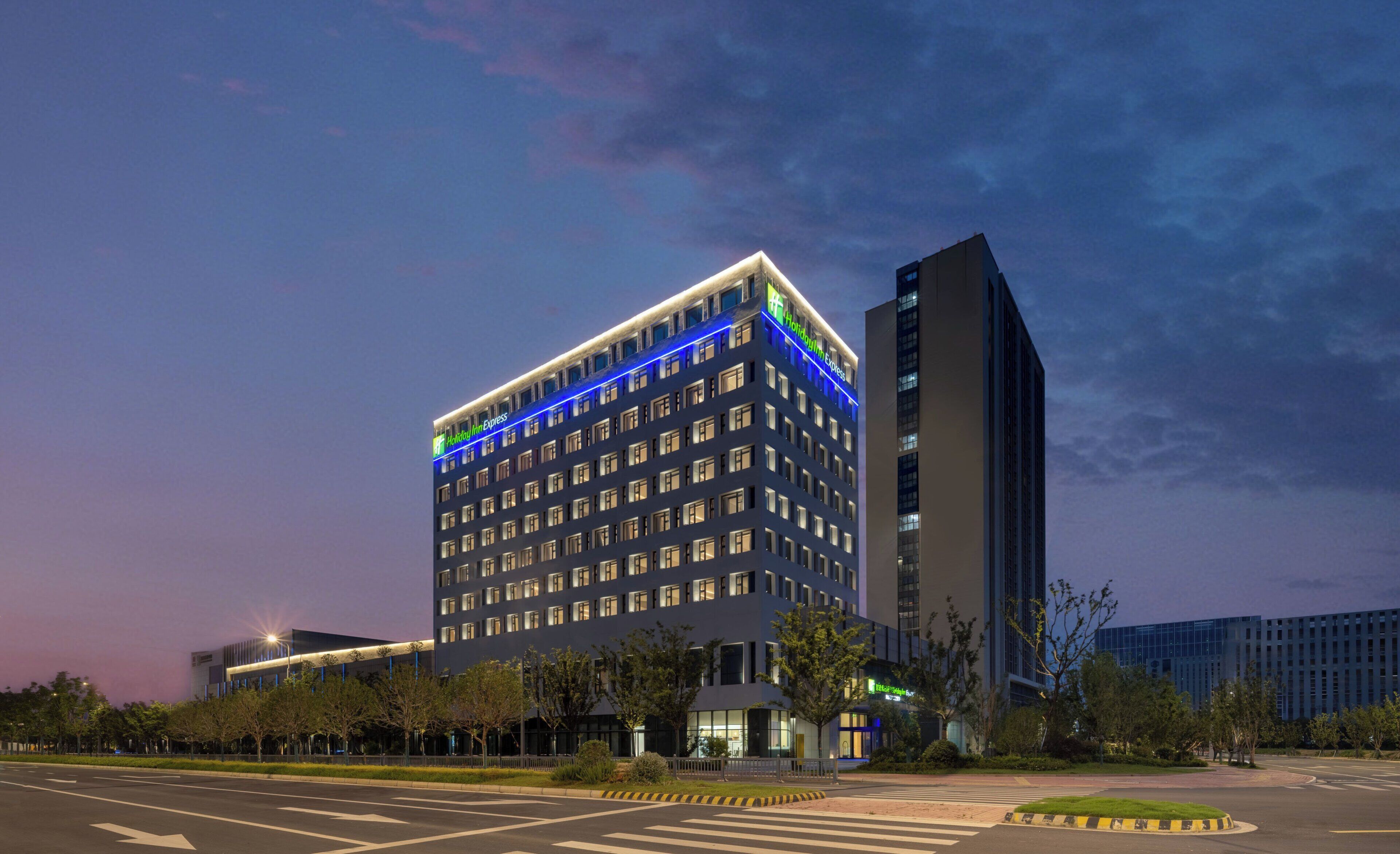 A multi-story hotel with a modern design, featuring a prominent 'Holiday Inn Express' sign.