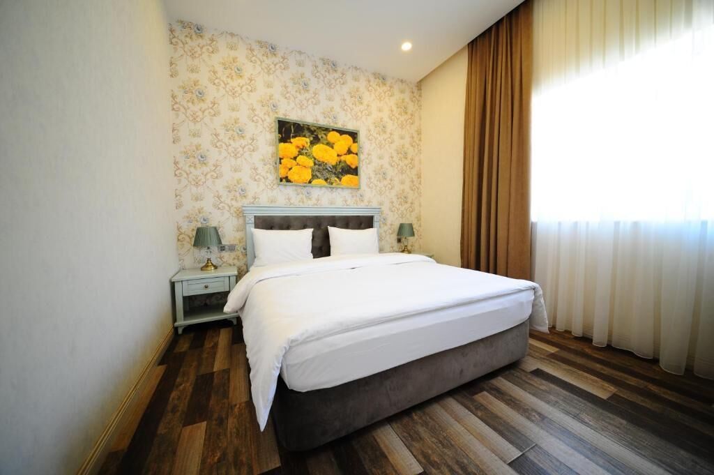 Habitación doble Deluxe | Minibar, caja de seguridad en la habitación y cunas gratuitas 