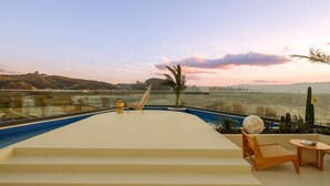 A rooftop pool with a view of a body of water and distant hills. - Dali Fanxi Manhai Holiday Guesthouse (Dali)