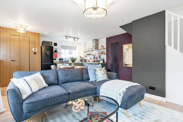 A bright and inviting living room designed for comfort and relaxation. Featuring cozy seating and a welcoming atmosphere, it’s the perfect place to unwind after a long day, enjoy a movie, or spend quality time with family and friends.