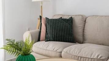 Apartment, 2 Double Beds, City View | Living area | 40-inch Smart TV with digital channels