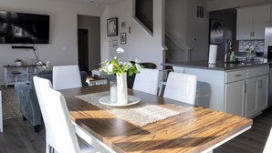A modern kitchen with white cabinets, a stainless steel sink, and a built-in oven. - Holistic Campus Rental, LLC - Private Bedrooms in Shared Home with Shared Kitchen (Oxford)