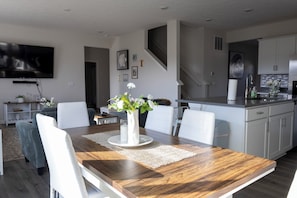 A modern kitchen with white cabinets, a stainless steel sink, and a built-in oven. - Holistic Campus Rental, LLC - Private Bedrooms in Shared Home with Shared Kitchen (Oxford)