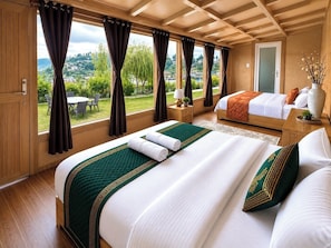 A hotel room with a large bed, a smaller bed, a view of the outdoors, and a wooden ceiling.