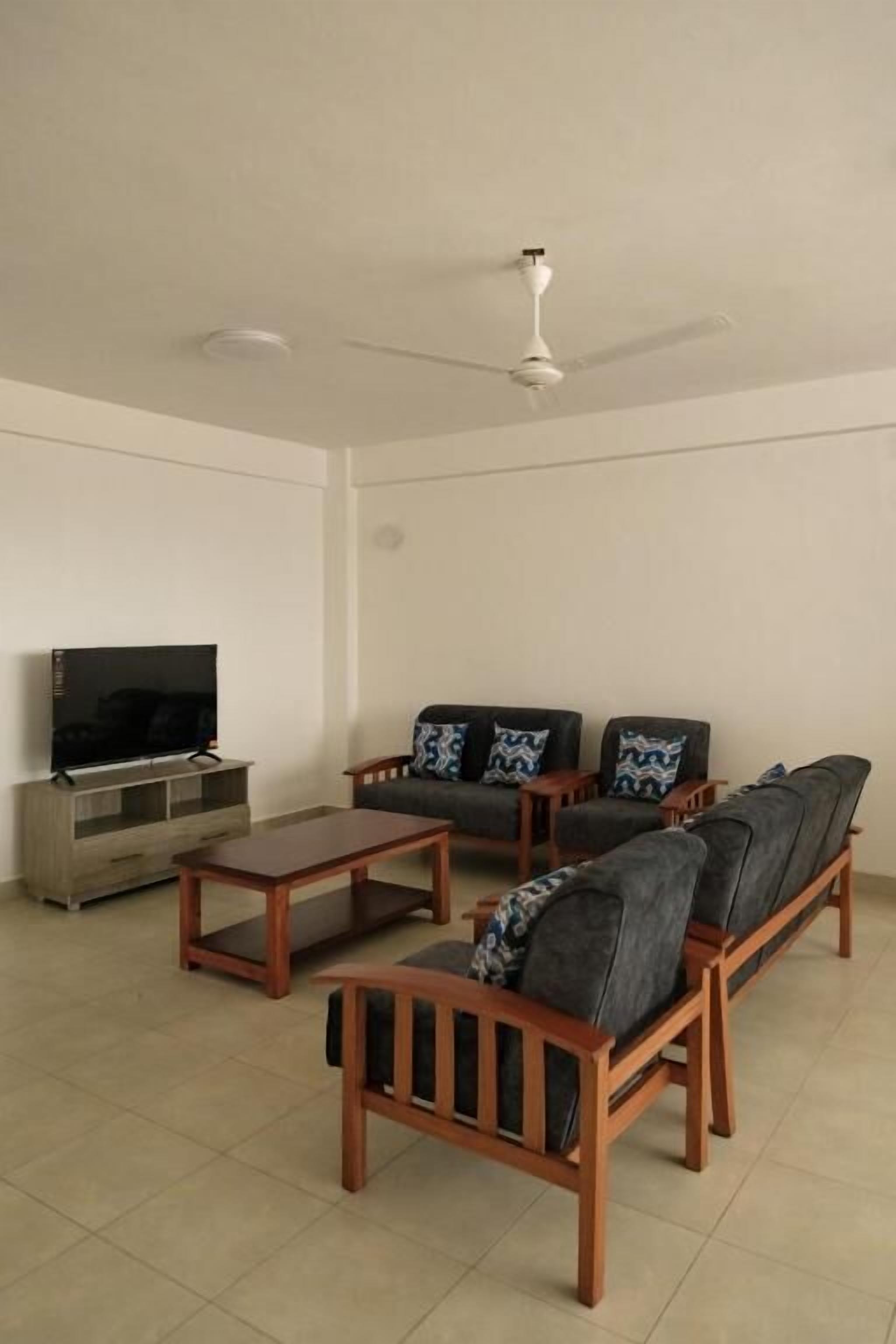 Deluxe Apartment, City View | Living area | 32-inch Smart TV with digital channels