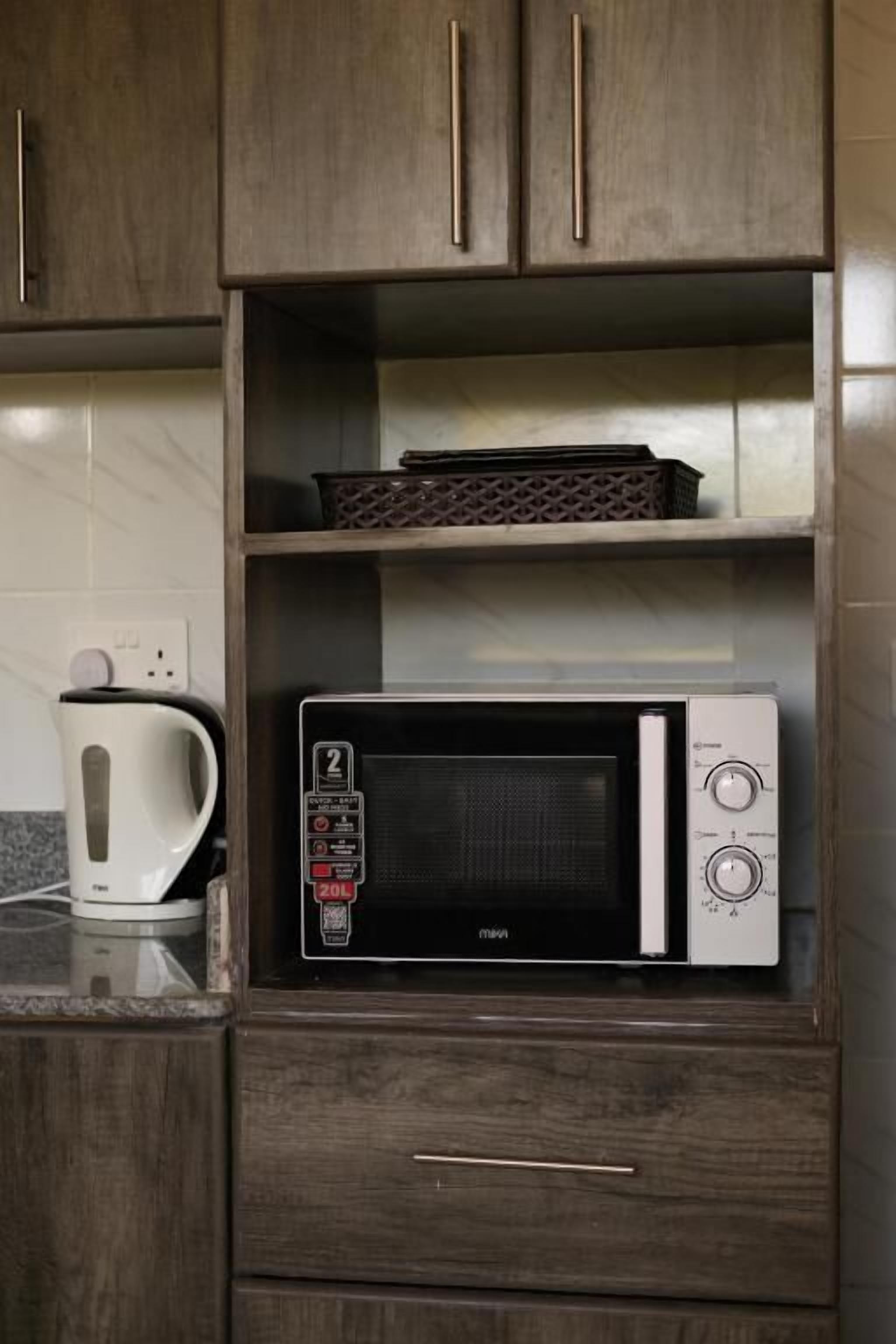 Deluxe Apartment, City View | Private kitchen | Fridge, microwave, cookware/dishes/utensils