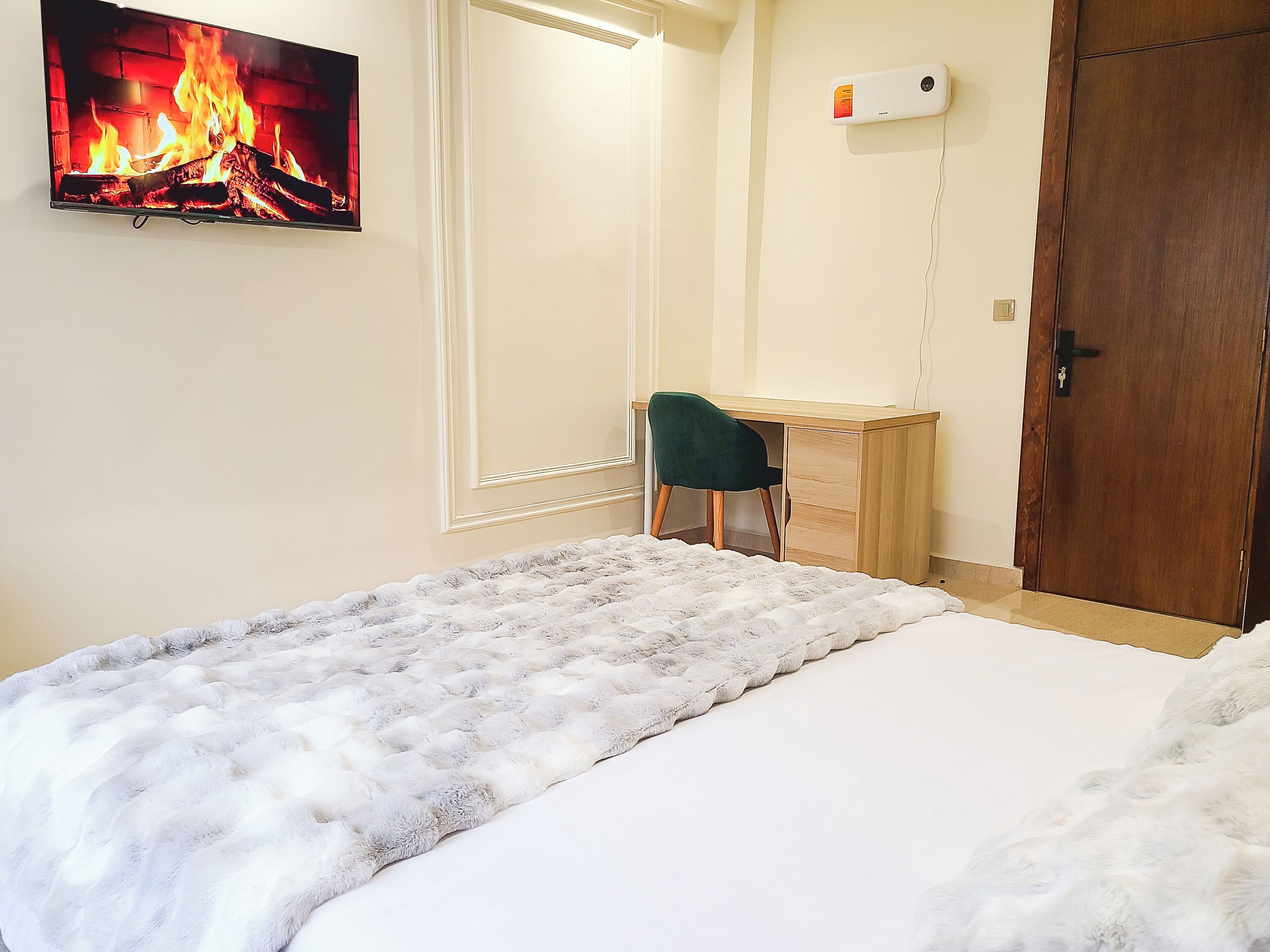 Appartement Confort | Coffres-forts dans les chambres, fer et planche à repasser