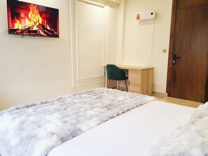 Appartement Confort | Coffres-forts dans les chambres, fer et planche à repasser