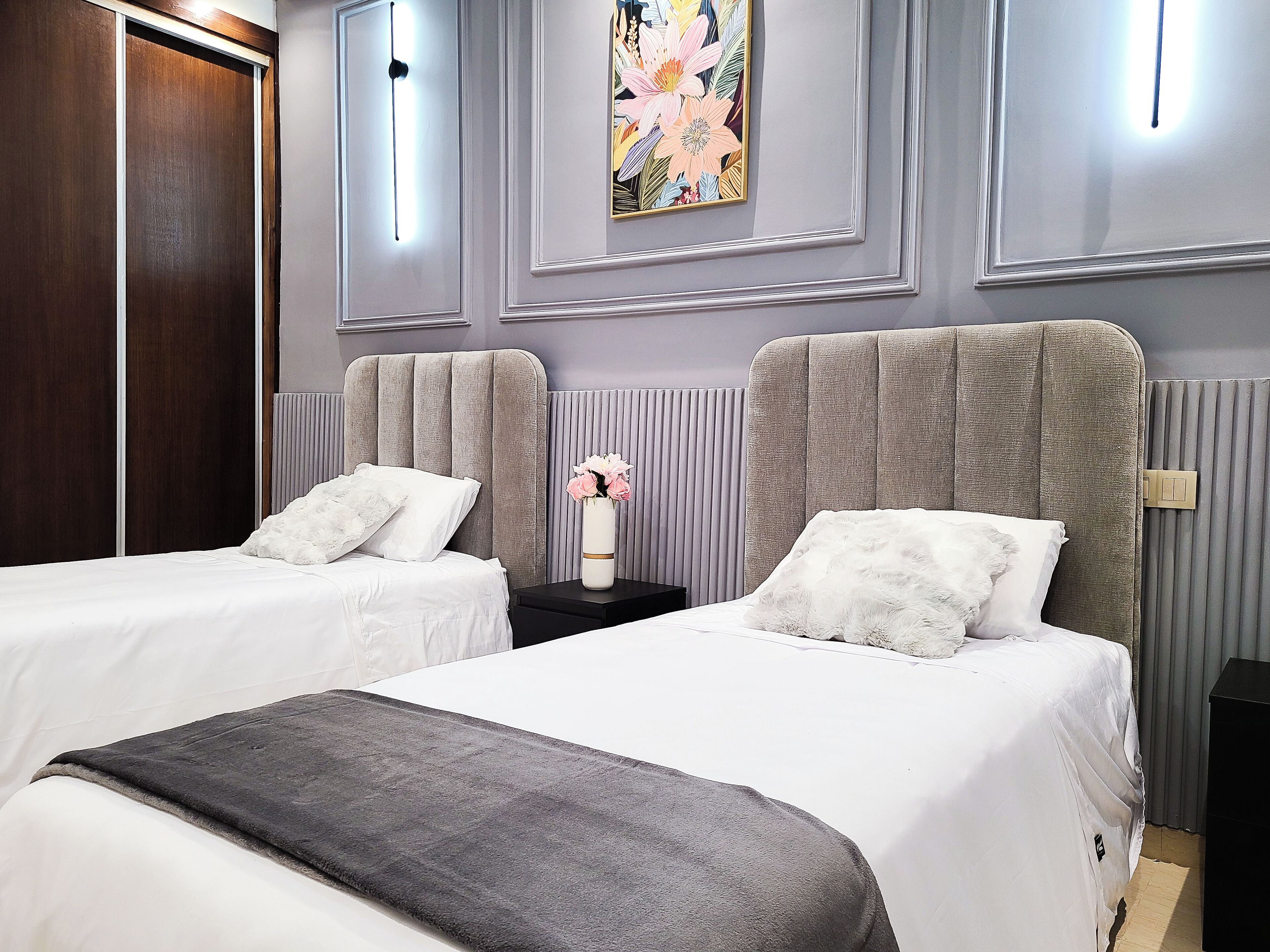 Appartement Confort | Coffres-forts dans les chambres, fer et planche à repasser