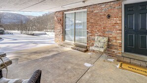 A brick building with a large window and a dark door. There is a welcome mat in front of the door. - 1/2 Mi to Kanawha River: Quiet Escape w/ Patio (Belle)