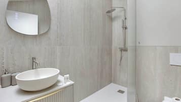 Shower, hair dryer, towels, shampoo