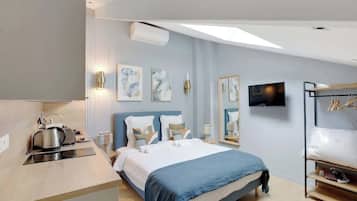 Tabla de planchar con plancha, wifi y ropa de cama